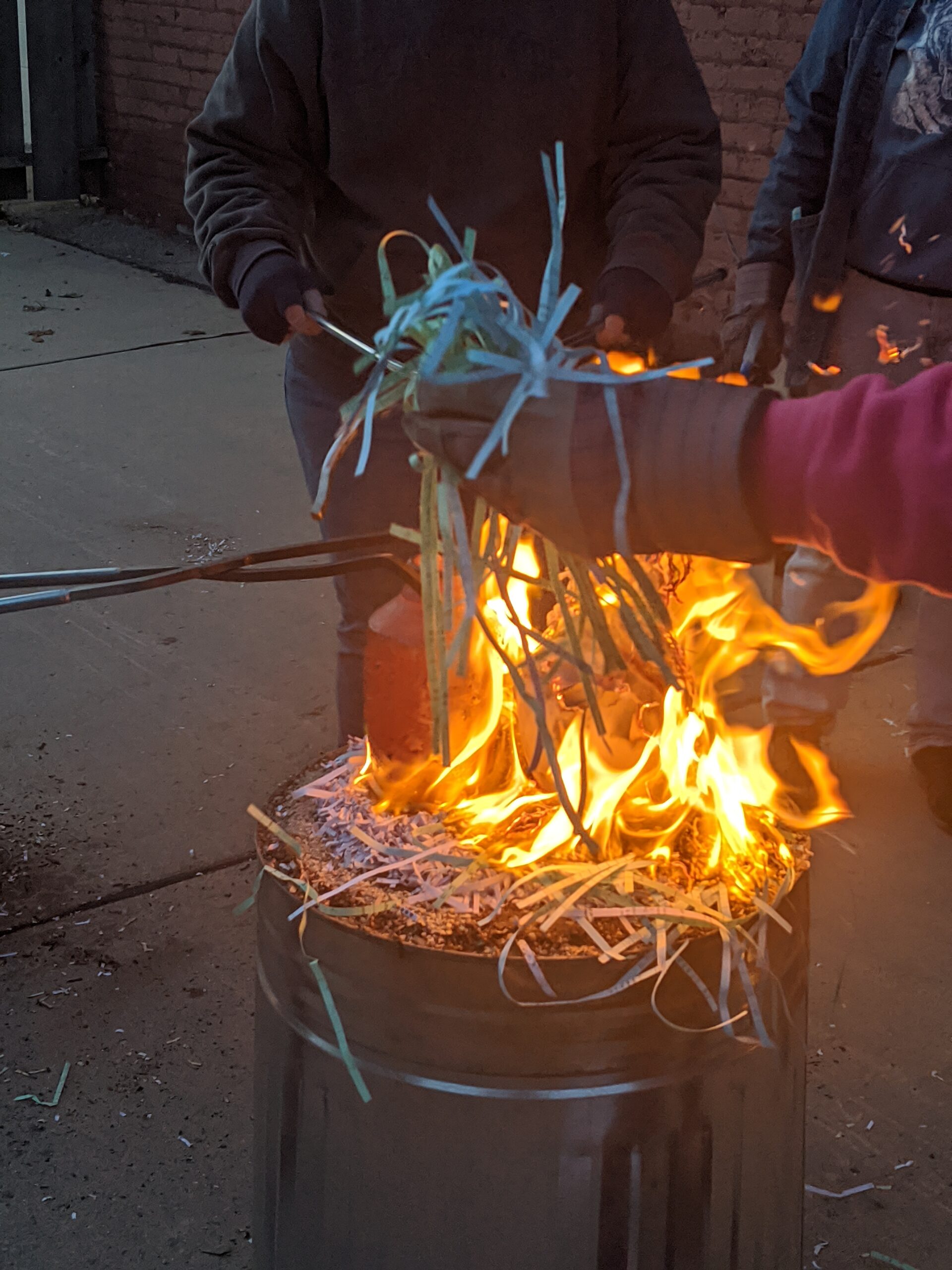 Raku workshop Flames surround a 1700 degree piece of pottery taken hot out of the kiln. This piece will be covered and allowed to smoke. This will produce high metallic lusters and rainbow effects.