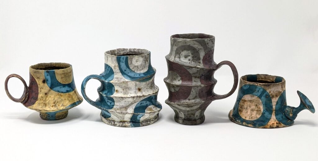 handmade coil and pinched ceramic mugs created and decorated by local Wisconsin artist Kate Marotz